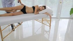 Male physiotherapist giving leg massage to female patient Stock Footage