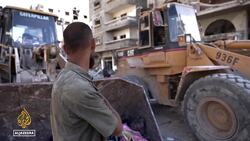 Bulldozers clear rubble in Gaza City as Palestinians return to rebuild homes and lives News Clip
