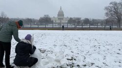 CLEAN : Snowball fights and snowmen outside US Capitol as snowstorm blankets Washington News Clip
