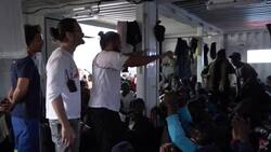 Migrants celebrate coming disembarkation in Italy Instructional Video