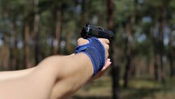 The girl shoots from an air gun Stock Footage