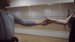 Man and a woman are dancing in the studio Stock Footage