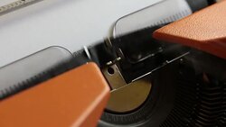 Close up footage of a person writing TERRORISM on an old typewriter Stock Footage