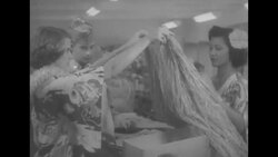 Soldiers shop, stand in line to mail gifts, and receive gifts around foxhole in December 1954 News Clip