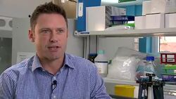 Oncologist Professor James Larkin talking about the amazing benefits cancer patients have received because of the research of Nobel Prize-winning scientists James Allison and Tasuku Honjo Stock Footage