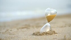 4k Sand clock on the beach, business concept teamwork & time management Stock Footage