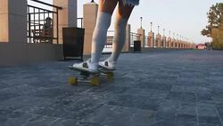 Young stylish attractive woman skateboarding at sunrise on seafront, slow motion, close up shot Stock Footage