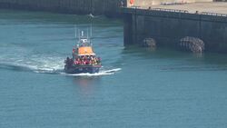 Second RNLI lifeboat transports suspected migrants into Dover News Clip