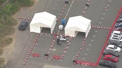Aerials of a drive-through coronavirus test centre in Watford News Clip