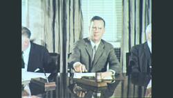 United States, 1960s: man stands in front of board room attendees Stock Footage
