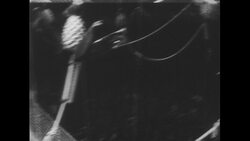 United States, 1950s: Performers on trapezes, man catches woman Stock Footage