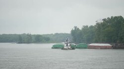 Soy Bean Grain Barge travels across river News Clip
