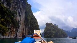 Moving follow boat with Beautiful mountains lake river sky and natural attractions in Ratchaprapha Dam at Khao Sok National Park, Surat Thani Province, Thailand. Stock Footage