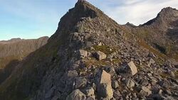 Aerial view flying up a mountain Stock Footage