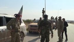 CLEAN : Pro Ankara Syrian fighters move through Turkish border town News Clip