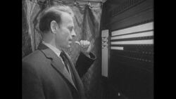 1960s: Man in voting booth struggles with a decision Stock Footage