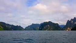 view of landscape limestone mountain rang and green forest with water lake Stock Footage