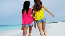 Smiling carefree multi ethnic female on vacation beach Stock Footage