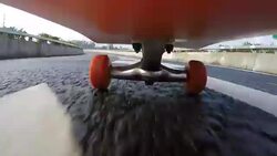 Under skateboard POV - People skating on a highway road. Stock Footage