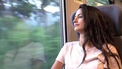 Young beautiful woman traveling by train Stock Footage