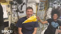 Slow Motion Video Captures Astronaut Eating A Slice Of Orange In Space Station Instructional Video