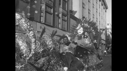 Winter Carnival parade; King Boreas, floats; speed skating races at Lake Como, winners Carow, Gibson, Bartholomew; both events in St. Paul News Clip