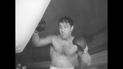 1954 in Sports: Ezzard Charles fails to regain World's heavyweight title from Rocky Marciano; Holy Cross defeats Duquesne to win NIT Crown News Clip