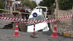 Car falls into sinkhole in Istanbul Stock Footage