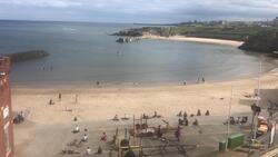 Public enjoy sunshine on English beach News Clip