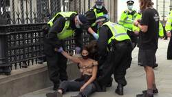 Police detain topless Extinction Rebellion protesters in London News Clip