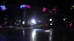 Colorful spinning wheel in amusement park at night Stock Footage