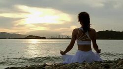 Woman Yoga - relax in nature Stock Footage