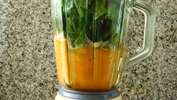 Cocktail from carrots, a stalk of a apium and spinacia.	Process of preparation of cocktail. Stock Footage