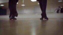Dancing male and female legs in the dance studio Stock Footage