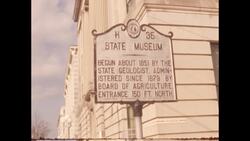 1970s: Man looks into microscope Stock Footage