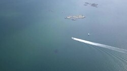 Drone shot of boat going through the Swedish archipelago Stock Footage