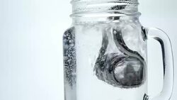 Boiling water with immersion heater Stock Footage