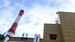 Smoking stack of the thermal power station against a blue sky. Smoking stacks of thermal power station. Stock Footage