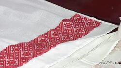 National red and white embroidery. The process of decorating decorative towels embroidered red ornament. Stock Footage