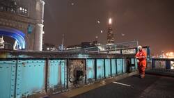 Tower Bridge engineers prepare to replace critical components on rainy night in London News Clip