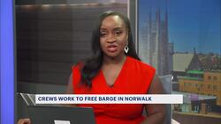 Crane barge unloading gravel to free stuck barge in Norwalk River News Clip