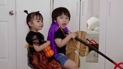 Asian brother and sister with Halloween dress while playing and acting like Ghost with humor and positive emotion Stock Footage