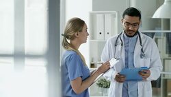 Young Doctors Discussing Work in Clinic Stock Footage