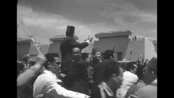 Tunisian nationalist leader Habib Bourguiba is welcomed by huge crowds upon returning home from French exile News Clip