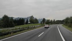 Driving on the highway by the mountain range Stock Footage