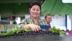 Japanese Ethnicity Woman Buying Jabuticaba / Jaboticaba on Farmers Market Stock Footage