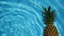 Pineapple Floating In blue Water In Swimming Pool. Healthy Raw Organic Food. Juicy Fruit. Vegetarian, Vegan Nutrition, Vitamins, Diet, summer holidays, vacation concepts. Exotic tropical background Stock Footage