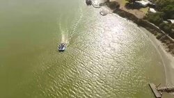 AERIAL boat on estuary/ Port Elizabeth/ South Africa Stock Footage