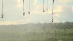 Pivot irrigation system. 120fps slow-motion close-up of pivot sprinkler system irrigating crops. Irrigation pivot system watering agriculture field Stock Footage