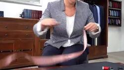 in a taylor shop a female taylor is measuring the fabric Stock Footage